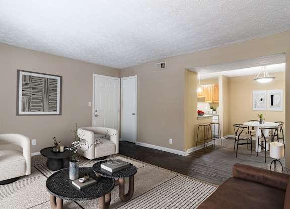 Spacious living room with natural light and comfortable seating in a pet-friendly home at Stratford Ridge Apartments in Marietta, GA.