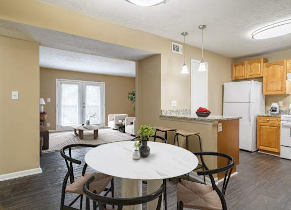 Dining room at Stratford Ridge Apartments near Smyrna, GA, featuring ample space for meals and gatherings with natural lighting and modern fixtures.