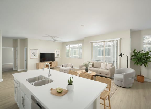 A modern kitchen with a white countertop and a wooden cutting board on it.
