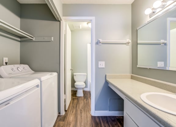 The Commons Apartments in Tampa Florida photo of a bathroom with a washer and dryer