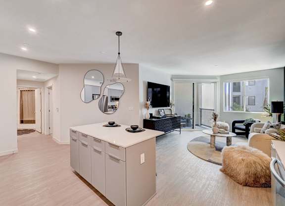 A modern kitchen with a white countertop and a large island.