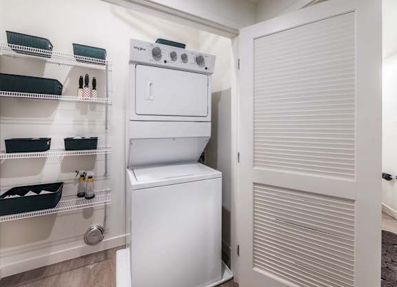 A white oven and dishwasher are in a small kitchen.