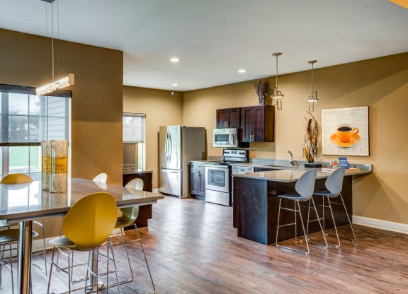 a kitchen and dining area in the club house