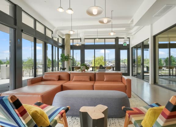 a living room filled with furniture and a large window