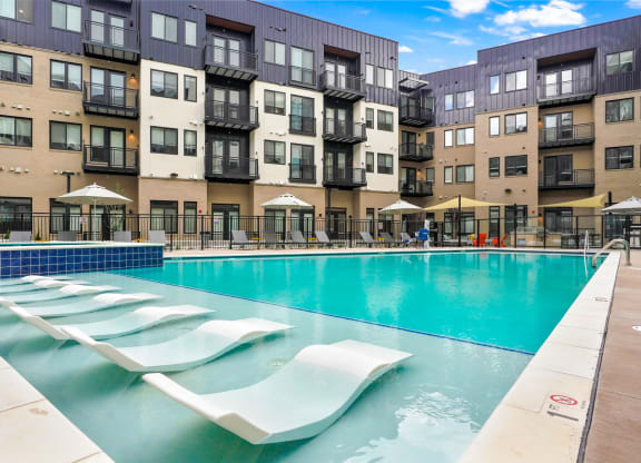 Apartments for Rent in Wheat Ridge - Parallel - Resort-Style Pool with In-Water Loungers, Deskside Lounge Chairs, and Spa