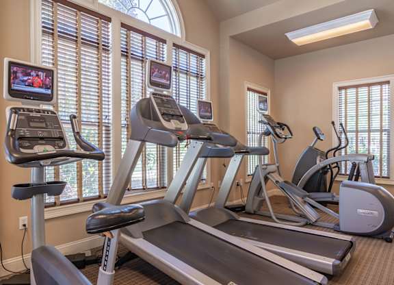 •	Apartments in Opelika for Rent – The Crossings of Opelika - fitness center with cardio equipment