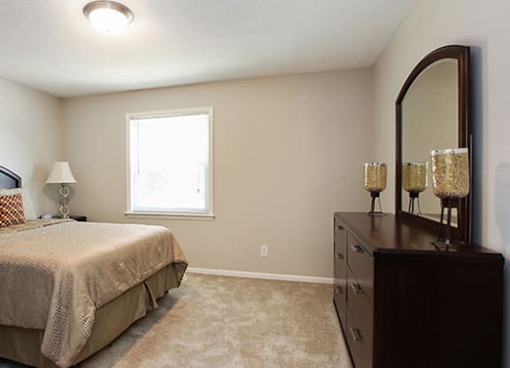 Pet-Friendly Apartments in Atlanta, GA – Estuary –a bedroom with a bed and a dresser