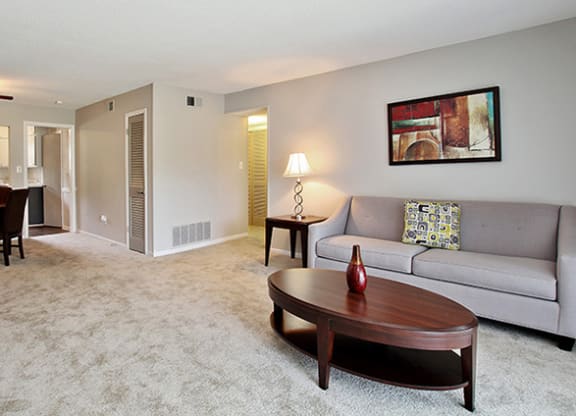 Pet-Friendly Apartments in Atlanta, GA – Estuary –a living room with a couch and a table
