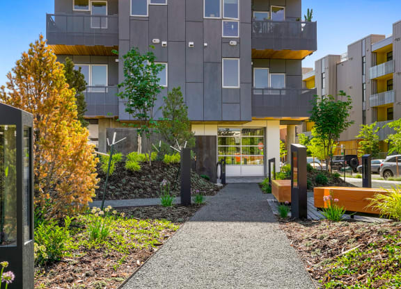 Exterior view of the front of Meredith House with a walkway and landscaping