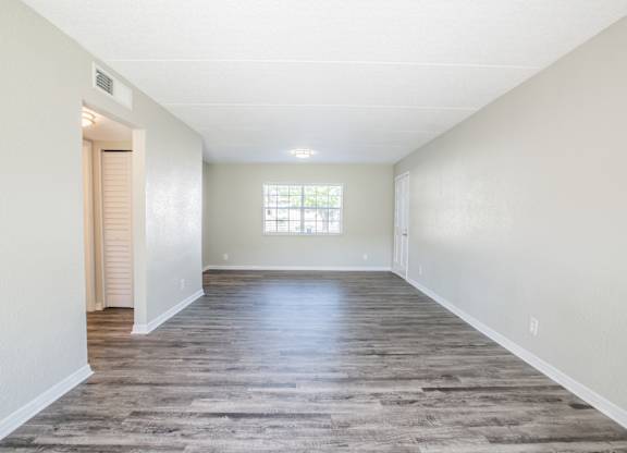 Spacious living room with window and good natural light at Townsend Apartments in Jacksonville near Atlantic Beach, Florida.