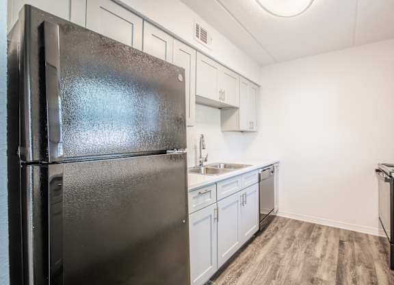 Kitchen with black appliances at Townsend Apartments in Jacksonville near Atlantic Beach, Florida.