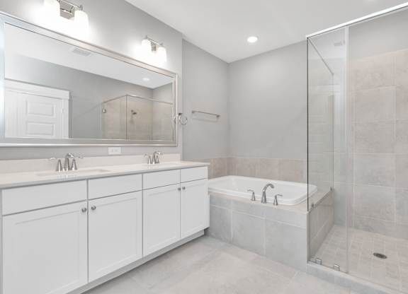 a bathroom with a bathtub and a sink