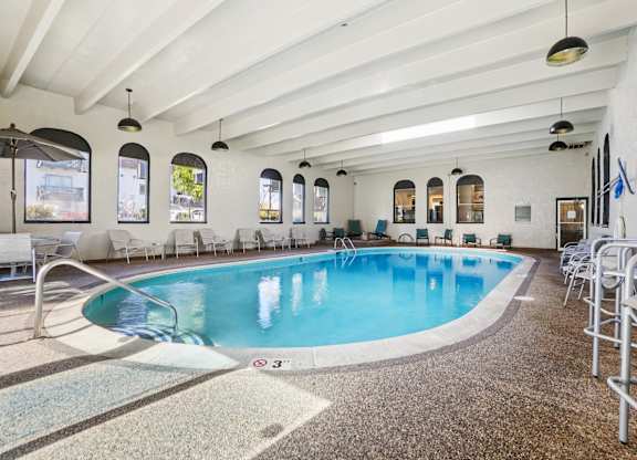 Trailgrove Apartments indoor pool amenity near 2470 South Quebec Street with spacious seating and bright skylights