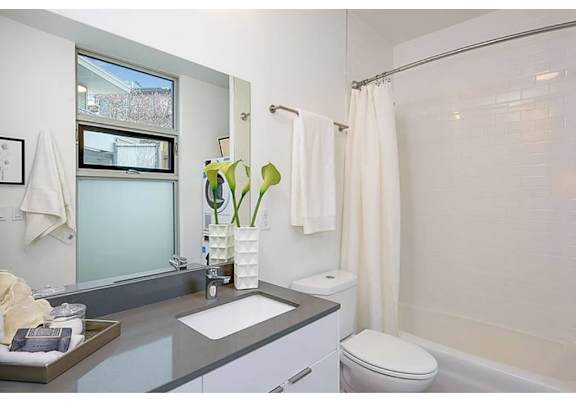 Bathroom with grey countertops