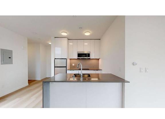 1 bed 1 bath kitchen grey countertops