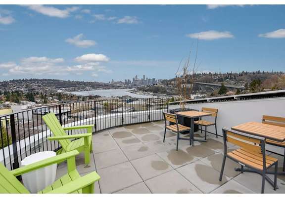 Freemont Apartments for Rent-Inspire Fremont-Roof Terrance with Lounge Seating, Tables, and an Amazing View