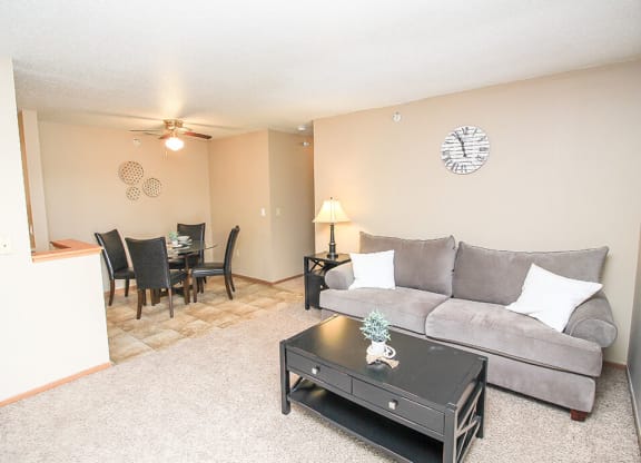 a living room with a couch and a table