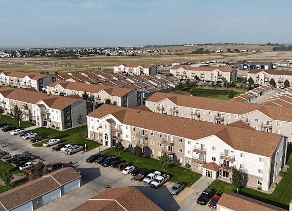 A large apartment complex with multiple buildings and parking lots.