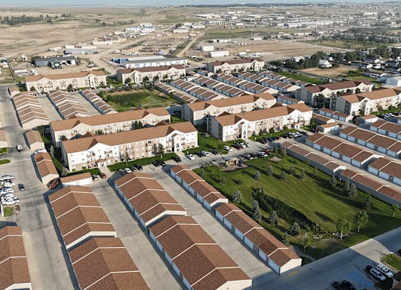 A large housing development with rows of houses and apartment buildings.