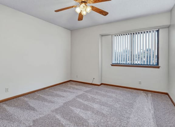 apartment bedroom with ceiling fan