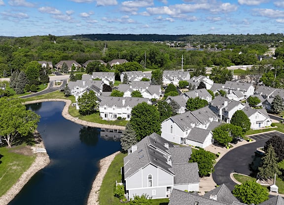 A pondflows through a residential neighborhood.