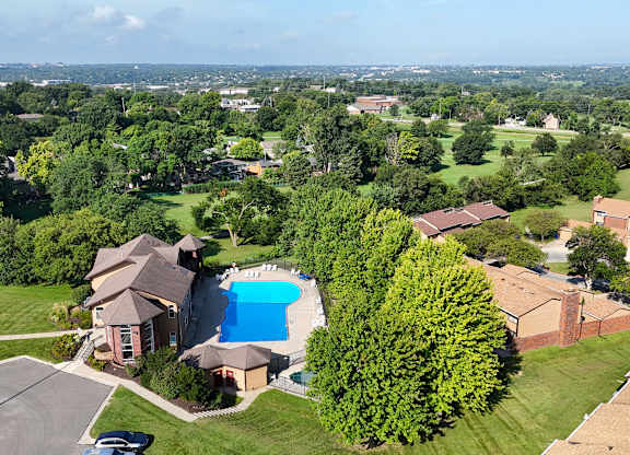 A large house with a pool in the backyard.