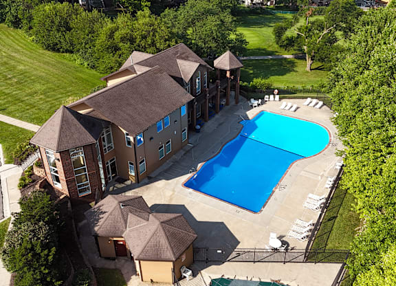 A large house with a pool in the backyard.