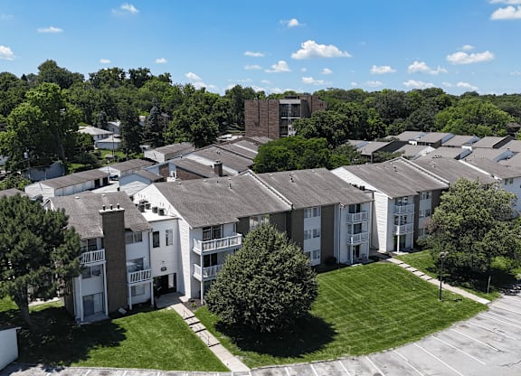 Apartment complex with a mix of brick and siding exteriors.