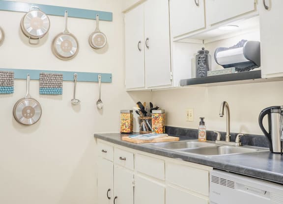 a kitchen with dishwasher and sink