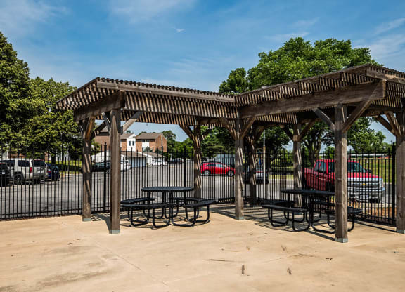a picnic shelter with tables