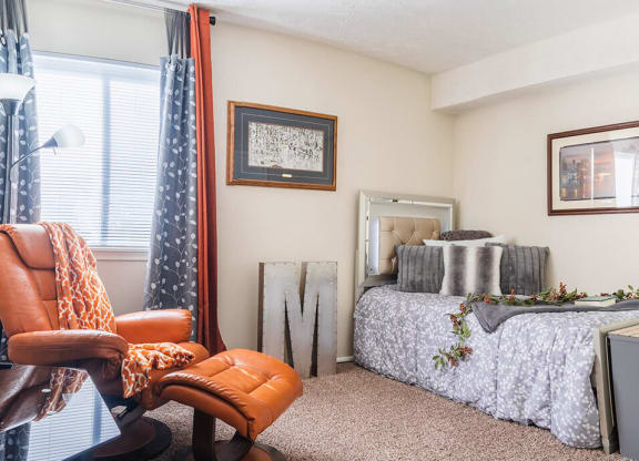 a bedroom with a bed and a window