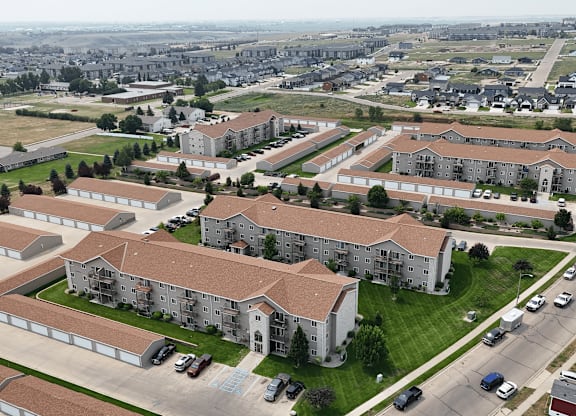 A large apartment complex with multiple buildings and parking lots.