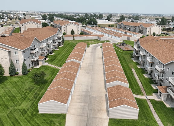 A large housing complex with a long road running through it.
