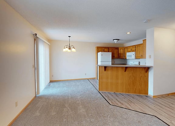 A kitchen area with a counter and cabinets.