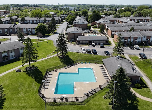 An aerial view of a community with a swimming pool.