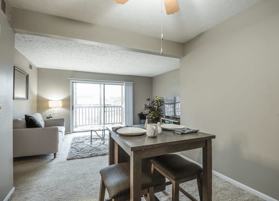 an open living room and dining room with a table and chairs