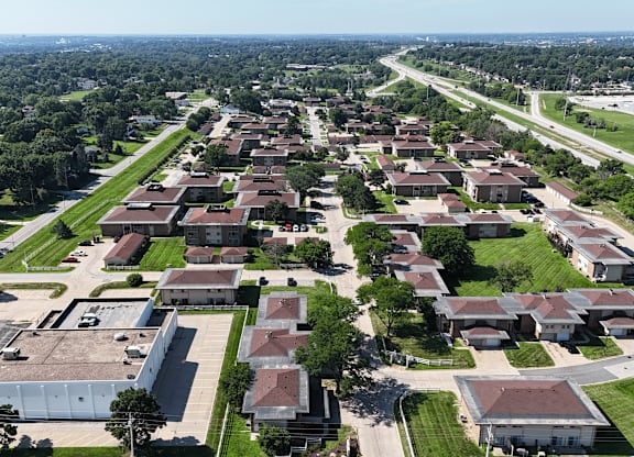 A large residential area with houses and a road.