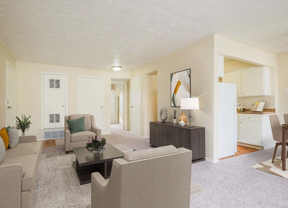 apartment living room with connected dining and kitchen area