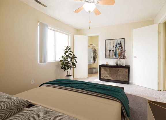bedroom with large attached closet at georgetowne apartments