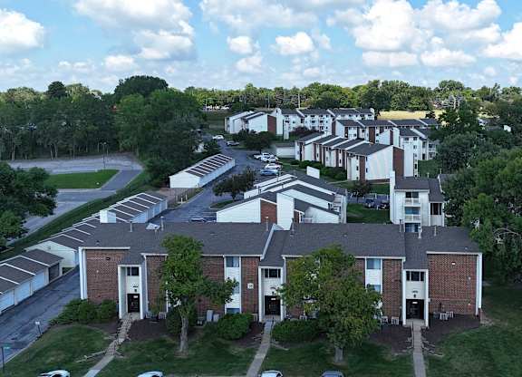 A large apartment complex with multiple buildings and parking lots.