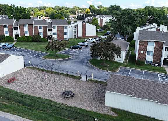 Apartment complex with a playground in the middle.