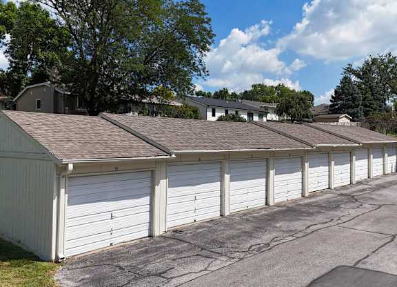 A long row of garage doors are closed.