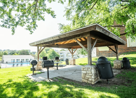 pavilion with a grill and a picnic table in a community