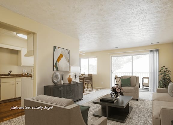 A living room with a grey couch and a coffee table.