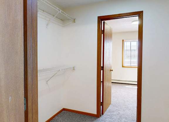 A room with a doorway leading to another room.