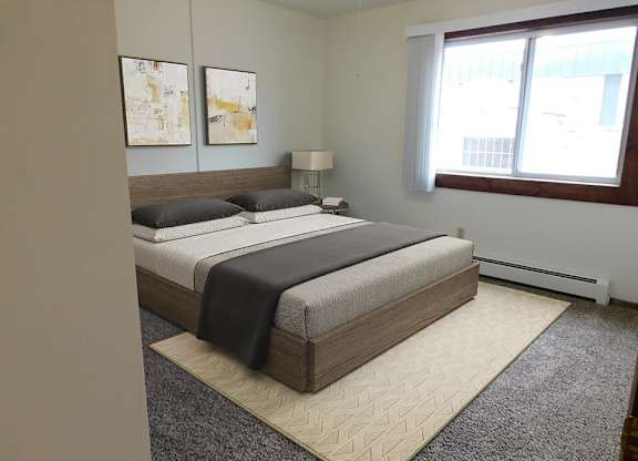 bedroom with natural light in heritage manor apartments