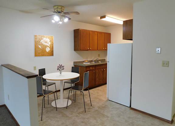 kitchen and dining area in apartment at heritage manor in rochester mn
