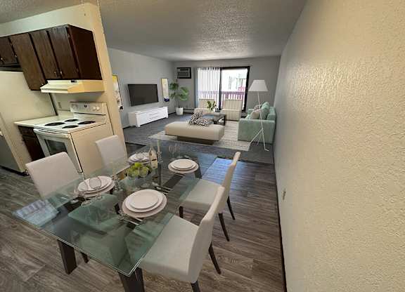 an aerial view of a living room and dining room with a glass table