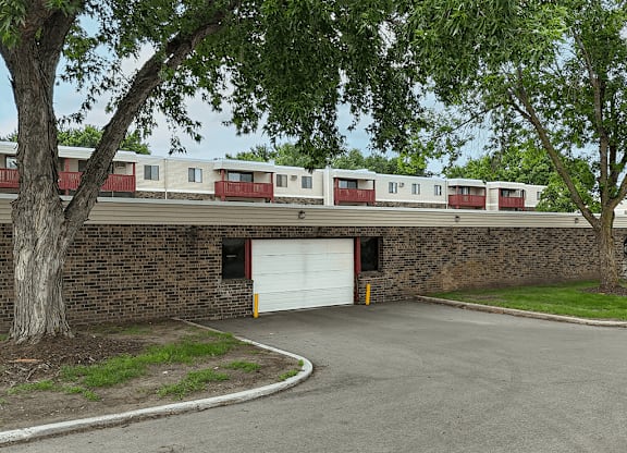 A train is parked behind a garage door.