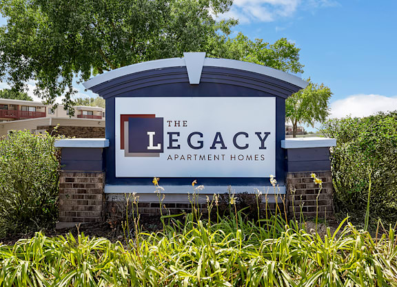 the legacy apartments sign at the legacy apartment homes entrance